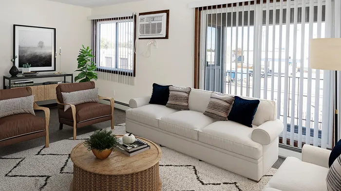 Inviting living room with comfortable seating, stylish decor, and abundant natural light through large windows.