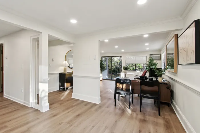 Bright open living space with modern decor, natural light, and elegant hardwood floors creating a welcoming atmosphere.