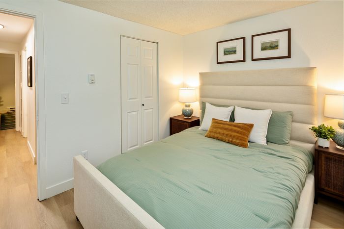 Inviting bedroom with cozy bedding, soft lighting, and elegant decor creating a warm ambiance.