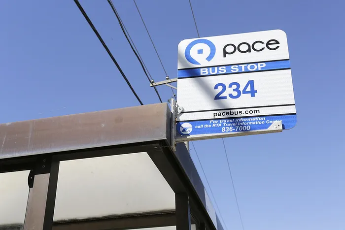 City bus stop 234 with a chic, modern design and vibrant blue sky backdrop, perfect for urban commuting convenience.