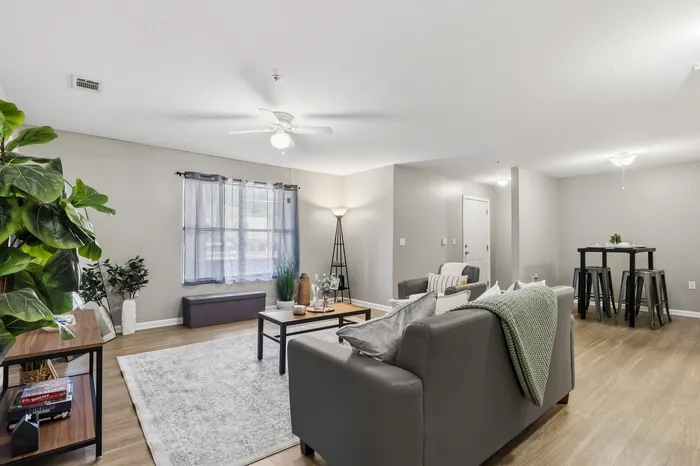 Inviting living area with modern furnishings, cozy seating, and stylish decor, perfect for relaxing and entertaining.