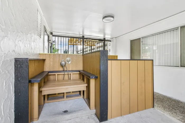 Bright and inviting indoor shower area with sleek wooden paneling and modern fixtures, perfect for relaxation.