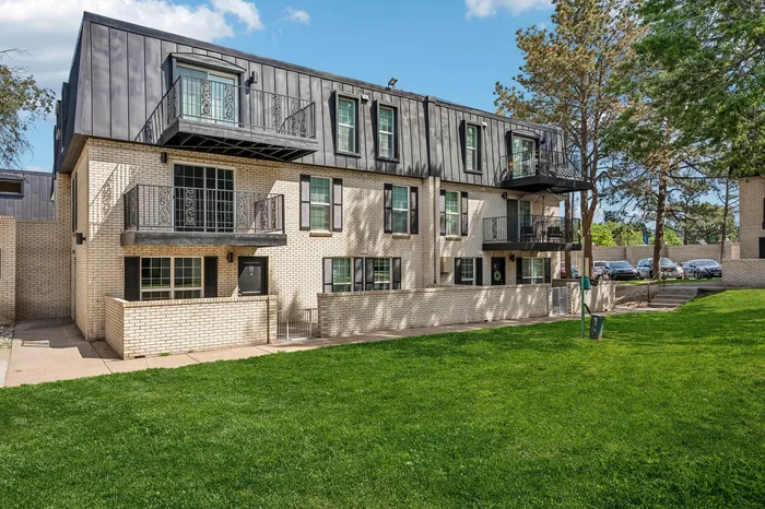 Charming apartment complex with modern balconies and lush green surroundings in a serene neighborhood.