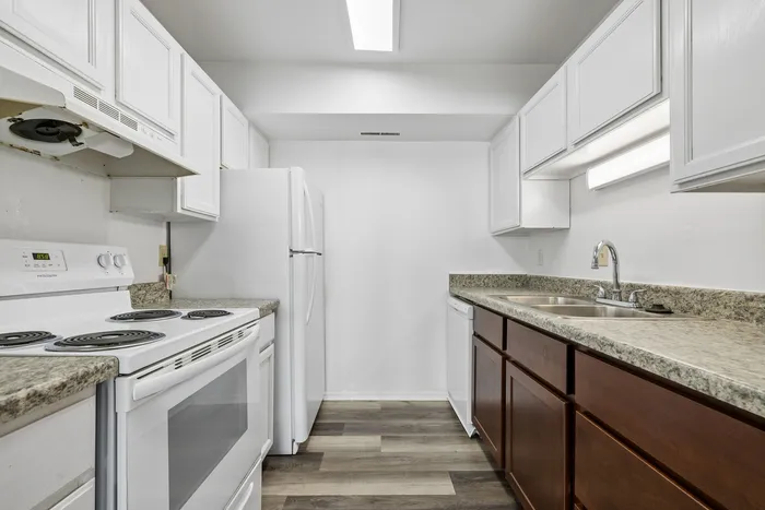 Contemporary kitchen with sleek countertops, ample cabinetry, and modern appliances, perfect for culinary enthusiasts.