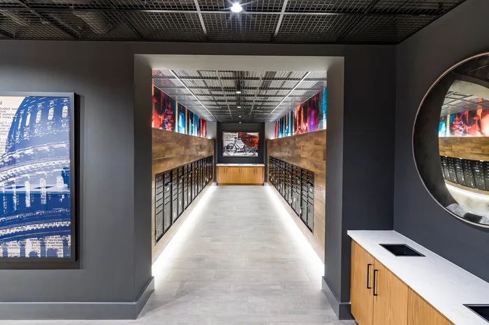 Contemporary mailroom with chic wooden accents, colorful artwork, and sleek modern design.