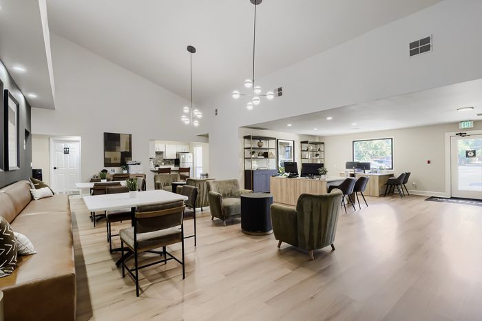 Spacious and modern community area with elegant seating, stylish lighting, and a welcoming atmosphere.