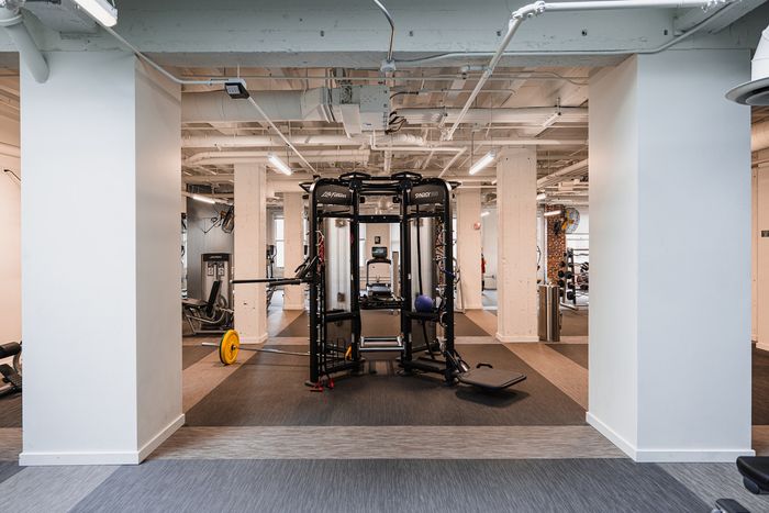 Modern fitness center with state-of-the-art equipment and sleek design, ideal for a healthy lifestyle.