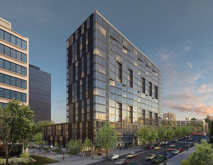 Modern high-rise apartment building with sleek glass facade and lush landscaping in a bustling urban setting.