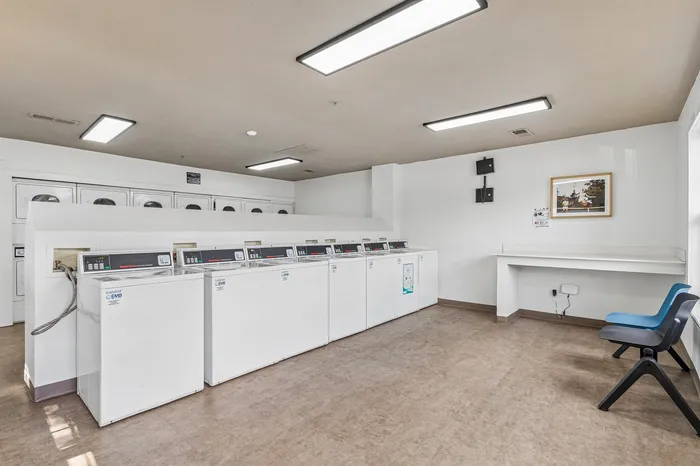 Bright and spacious laundry room with contemporary washing and drying facilities, offering convenience and comfort.
