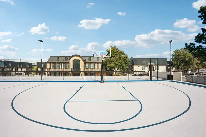 Inviting outdoor basketball court with modern surroundings and bright, open sky views.