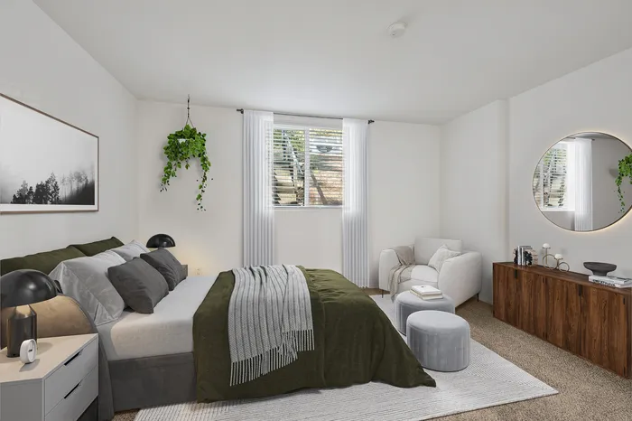Elegant bedroom with sophisticated decor, featuring a plush bed, cozy armchair, and stylish wooden dresser under a chic round mirror.