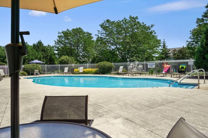 Outdoor swimming pool at Barrington Place Apartments in Madison, Wisconsin for seasonal relaxation and recreation.