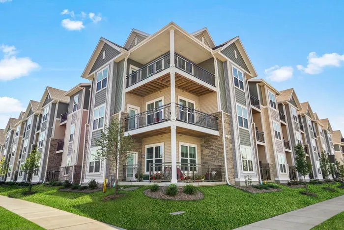 Apartment building exterior at The 85 at Maple Grove highlighting residential design in Madison, Wisconsin.
