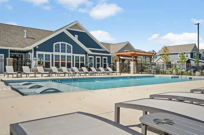 Heated outdoor pool at The 85 at Maple Grove featuring lounge seating and community space in Madison, Wisconsin.