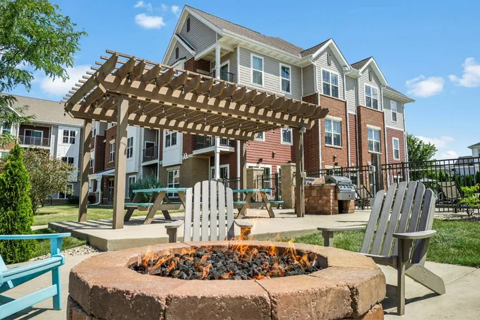 Outdoor picnic area at Elan Apartments in Fitchburg, Wisconsin offering shared seating and green space for residents.