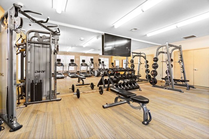24-hour fitness center at Elan Apartments in Fitchburg, Wisconsin equipped for strength and cardio workouts.