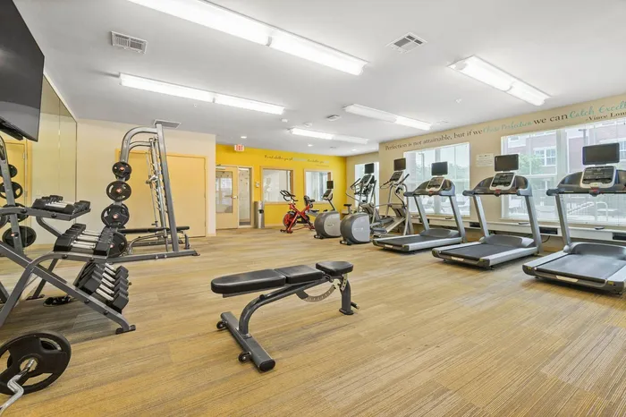 24-hour fitness center at Elan Apartments in Fitchburg, Wisconsin equipped for strength and cardio workouts.