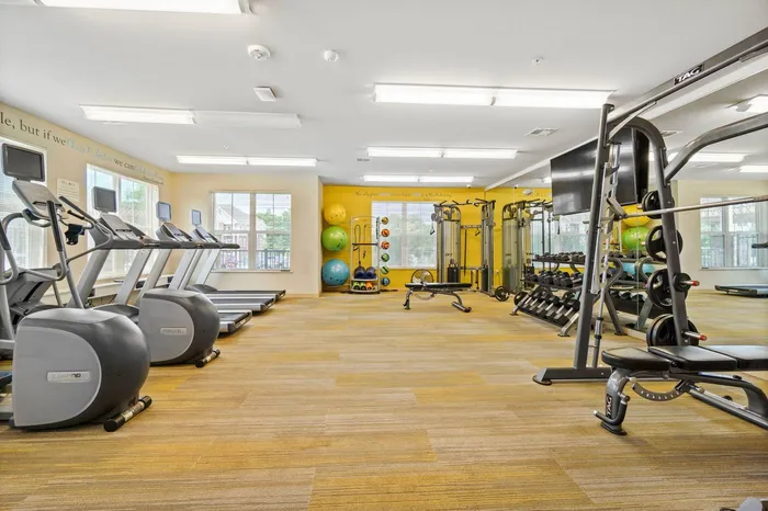 24-hour fitness center at Elan Apartments in Fitchburg, Wisconsin equipped for strength and cardio workouts.