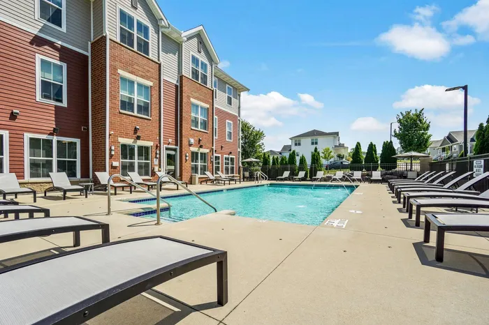 Sparkling outdoor swimming pool at Elan Apartments in Fitchburg, Wisconsin designed for relaxation and recreation.
