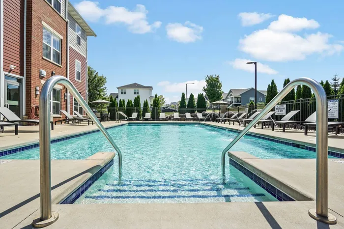Sparkling outdoor swimming pool at Elan Apartments in Fitchburg, Wisconsin designed for relaxation and recreation.
