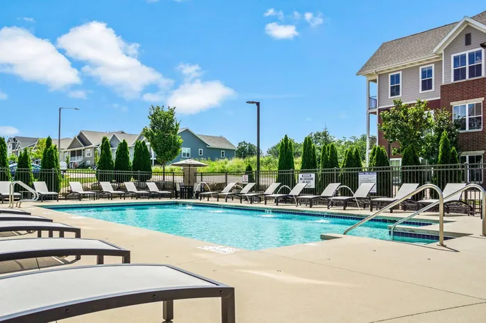 Sparkling outdoor swimming pool at Elan Apartments in Fitchburg, Wisconsin designed for relaxation and recreation.