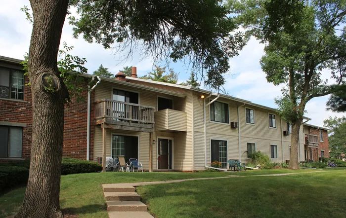 Apartment building exterior at Arbor Lakes Apartments in Middleton, Wisconsin, offering studio, one-bedroom, and two-bedroom apartments.