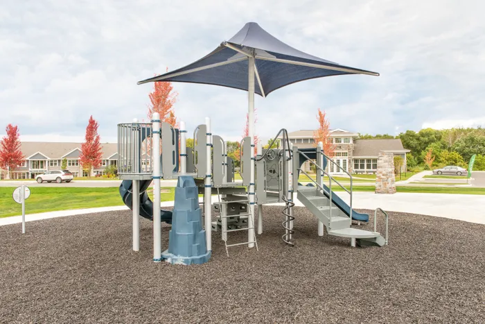 Community playground at Drexel Ridge Apartments in Oak Creek, Wisconsin designed for outdoor recreation.