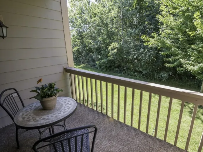 Private patio at Saddlebrook Apartments in Pewaukee, Wisconsin providing outdoor space.