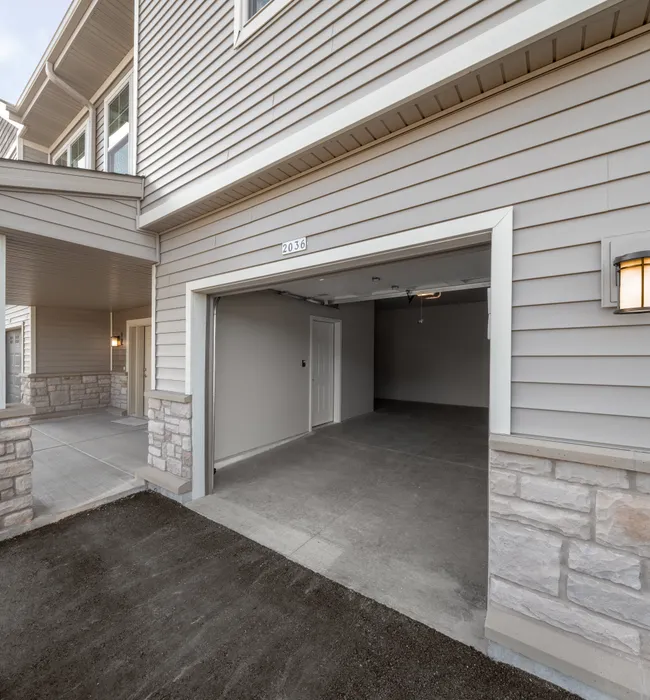 Attached garage at High Bluff Townhomes in Grafton, Wisconsin providing convenient resident parking.