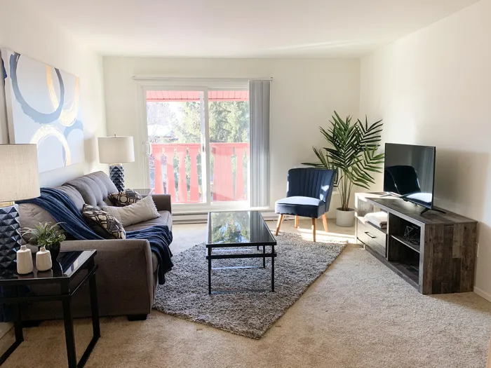 Living room at Ridge View Apartments in St. Francis, Wisconsin with comfortable layouts and natural light.