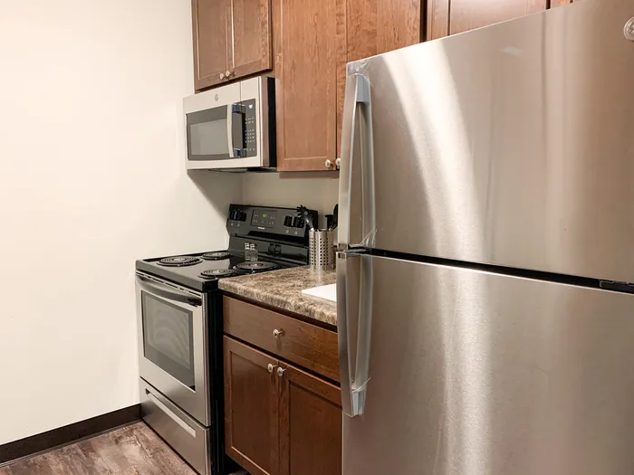 Kitchen at Ridge View Apartments in St. Francis, Wisconsin featuring functional layouts and ample storage.