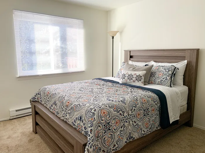 Bedroom at Ridge View Apartments in St. Francis, Wisconsin designed for comfort and relaxation.