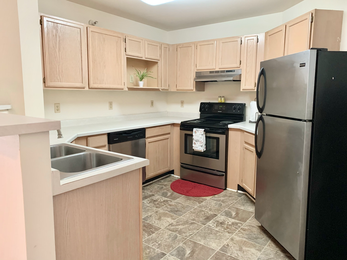 Modern apartment kitchen at Barrington Place Apartments in Madison, Wisconsin with spacious layouts and functional design.