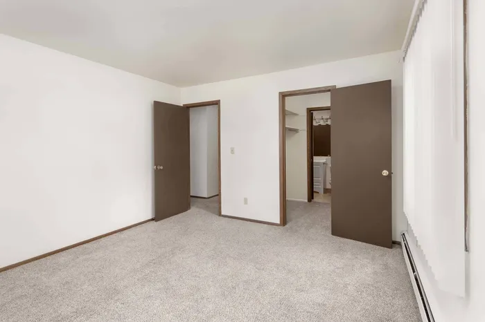 Bedroom at Stone Point Apartments offering comfortable space and natural light.