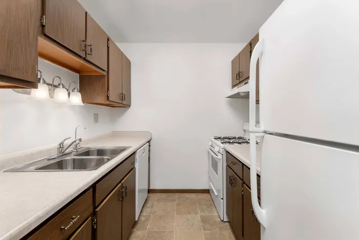 Fully equipped kitchen at Stone Point Apartments featuring updated finishes and functional layout.
