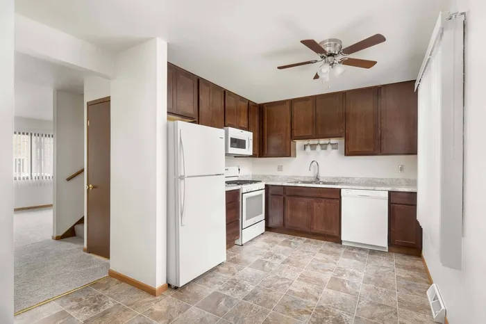 Fully equipped kitchen at Stone Point Apartments featuring updated finishes and functional layout.