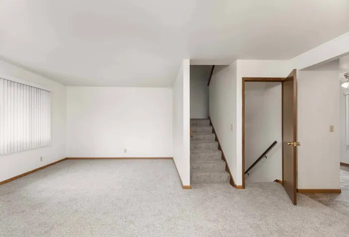Alternate living room view at Stone Point Apartments with open design.