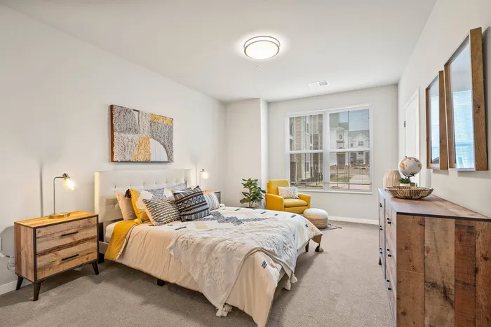 Apartment bedroom at The 85 at Maple Grove offering comfortable living space in Madison, Wisconsin.
