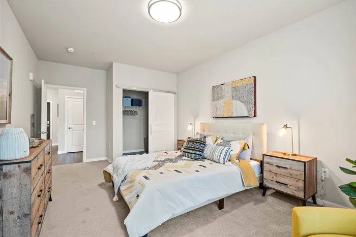 Apartment bedroom at The 85 at Maple Grove offering comfortable living space in Madison, Wisconsin.