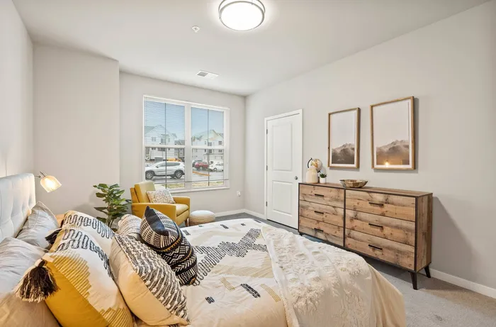 Apartment bedroom at The 85 at Maple Grove offering comfortable living space in Madison, Wisconsin.