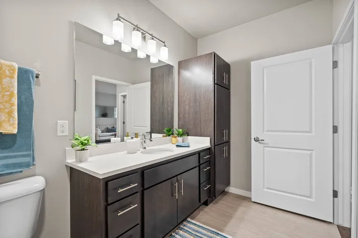 Apartment bathroom at The 85 at Maple Grove with modern fixtures and clean design in Madison, Wisconsin.