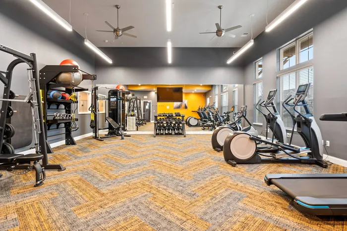 Fitness center at The 85 at Maple Grove equipped for resident workouts in Madison, Wisconsin.