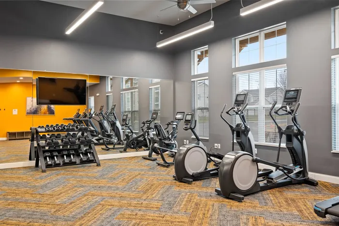 Fitness center at The 85 at Maple Grove equipped for resident workouts in Madison, Wisconsin.