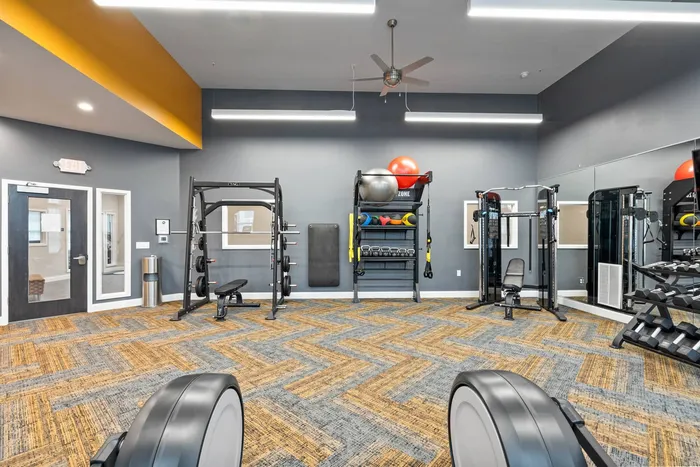 Fitness center at The 85 at Maple Grove equipped for resident workouts in Madison, Wisconsin.