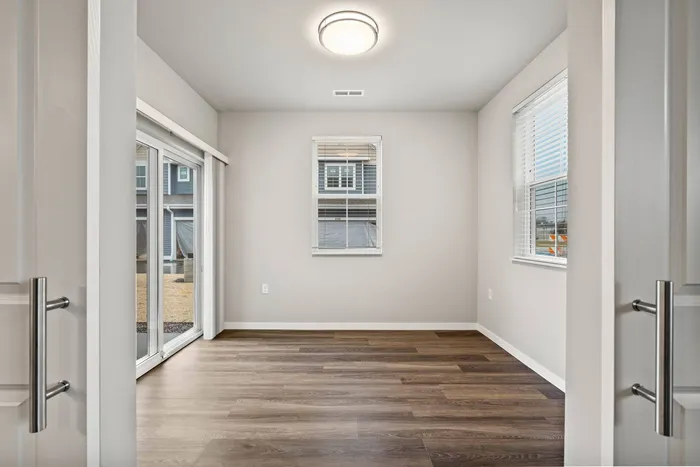 Townhome living room at The 85 at Maple Grove with open-concept layout in Madison, Wisconsin.