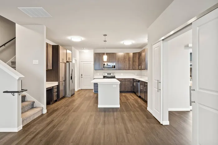 Townhome kitchen at The 85 at Maple Grove featuring spacious counters and functional design in Madison, Wisconsin.
