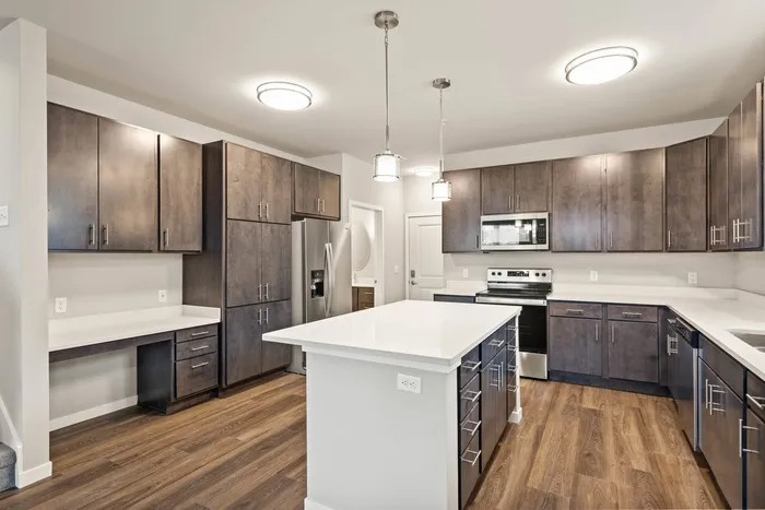 Townhome kitchen at The 85 at Maple Grove featuring spacious counters and functional design in Madison, Wisconsin.