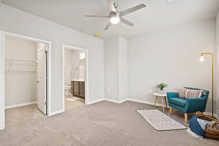 Stacked flats bedroom at The 85 at Maple Grove offering comfortable private living space in Madison, Wisconsin.
