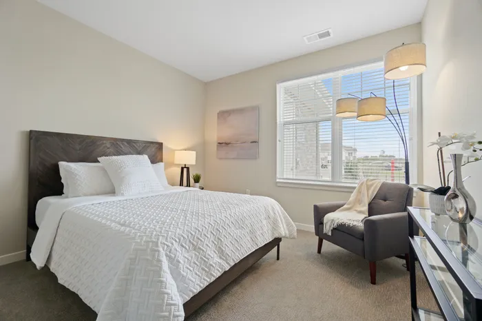 Bedroom at Seasons at North Aurora Apartments in North Aurora, Illinois offering comfortable layouts and storage space.