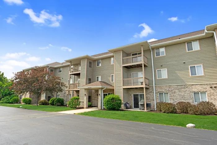 Exterior view of resident apartment buildings at Saddlebrook Apartments in Pewaukee, Wisconsin.